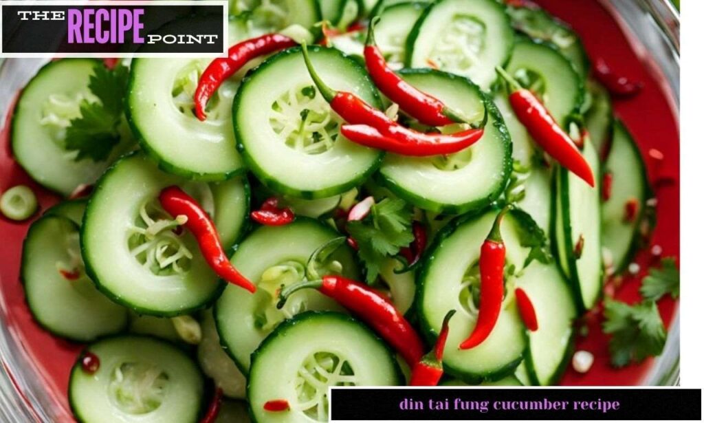 Din Tai Fung cucumber recipe in a bowl with garlic, sesame seeds,  and chili oil spices.